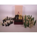 A boxed Staunton 4½" chess set together with a number of carved ivory chess pieces and two