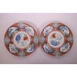 A pair of Chinese polychrome enamelled porcelain cabinet plates, decorated with landscape scenes,