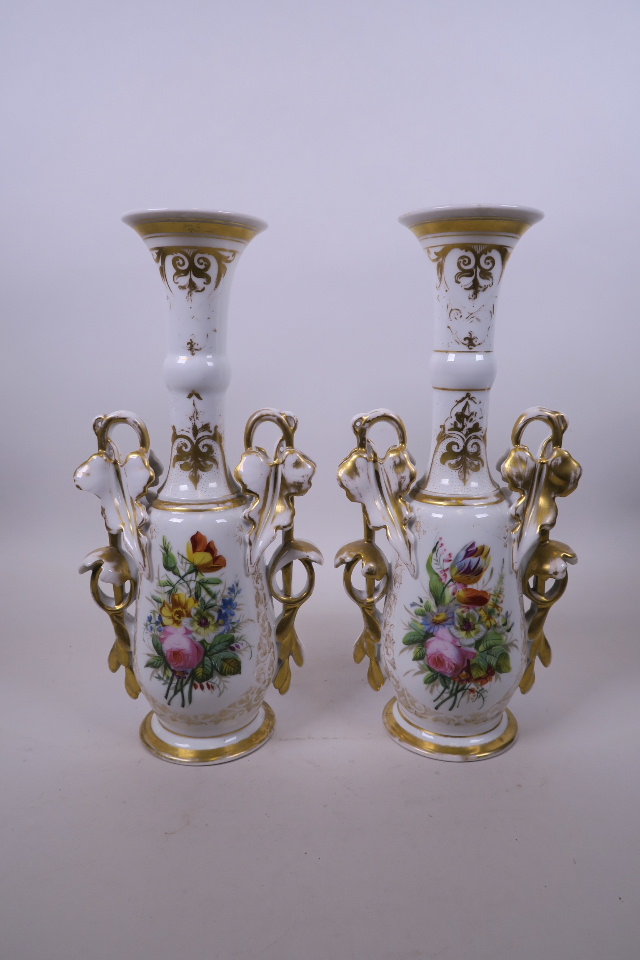 A pair of late C19th Paris porcelain vases, the handles in the form of vines, with gilt highlights