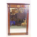 An Empire style inlaid mahogany pier glass with brass mounts and bevelled glass, 37" x 25"