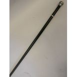 A C19th silver handled ebony walking cane with silver ferule inscribed: Presented to W.L. AUKETT