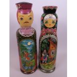 Two Russian hand painted wooden bottle boxes painted as dolls with panels of fairytale scenes, 14"