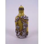 A Peking glass snuff bottle, with decoration of travelling figures, 3½" high