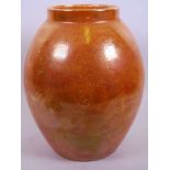 A Ruskin 'High Fired' bulbous pottery vase with orange glaze, impressed mark, A/F, 11" high