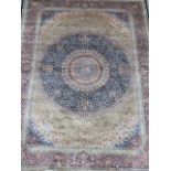 A fine Oriental woven silk rug, with traditional Shabaz design on a deep blue ground, possibly
