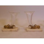 A pair of glass cornucopia, with brass mounts and alabaster bases, 9" high