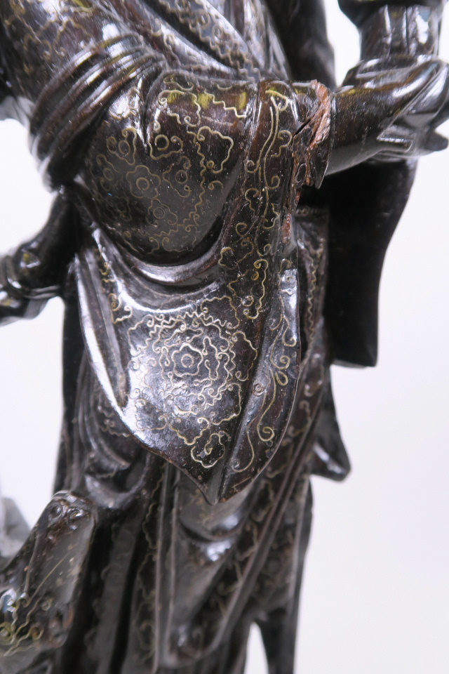 A Chinese carved and ebonised hardwood Quan Yin and child, with inset silver wire decoration, 17½" - Bild 2 aus 4