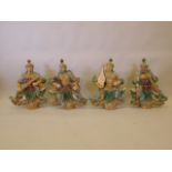 A set of four Chinese glazed terracotta figures of the four heavenly kings, 23" high
