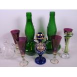 A collection of coloured glass including an enamelled Venetia posy vase, a pair of green onion vases