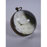 A brass bound glass ball desk clock, 3" diameter