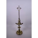 A Victorian brass adjustable whale oil lamp with four burners, 21" high