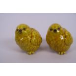 A pair of Chinese porcelain taper holders in the form of chicks, seal marks to bases, 2½" high