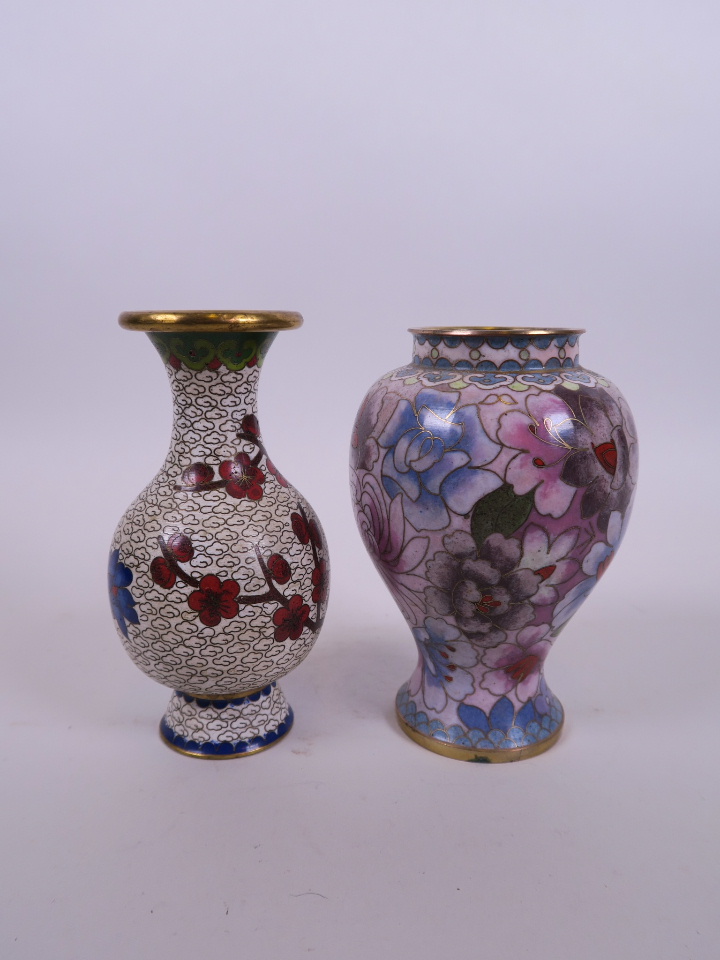 An Oriental cloisonné vase with peony decoration, together with another, 5" high