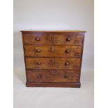 A C19th mahogany chest of two over three drawers, with turned wood handles, raised on a plinth,