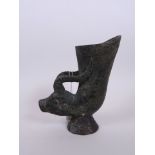 A Chinese bronze libation cup, the handle formed as a goat's head, impressed 4 character mark to