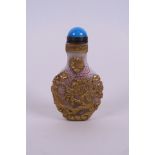 A Chinese Peking glass snuff bottle with carved, enamelled and gilt decoration of dragons, 2