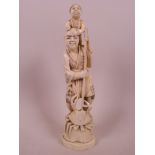 A Japanese carved marine ivory figurine of a man standing with a child on his shoulders and a