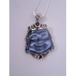 A silver pendant necklace in the form of Buddha's head set with semi precious stones, pendant 1½"