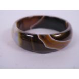 A banded brown agate bangle, 3" diameter