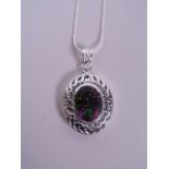 A silver pendant necklace set with an oval amethyst style stone, 1½" drop