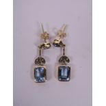 A pair of 9ct yellow gold and aquamarine set drop earrings, 1" drop