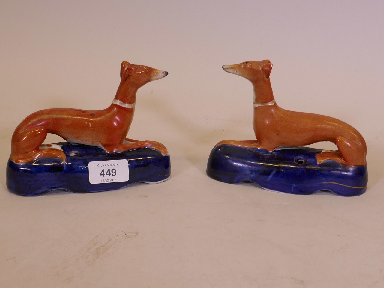 A pair of C19th Staffordshire greyhound quill holders, 6" long