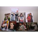 A collection of signed photographs of 'Eastenders' cast members, with an accompanying certificate of