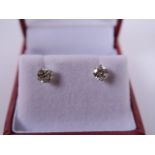 A pair of white gold and diamond set stud earrings, 80 points, colour L/M, Clarity SI