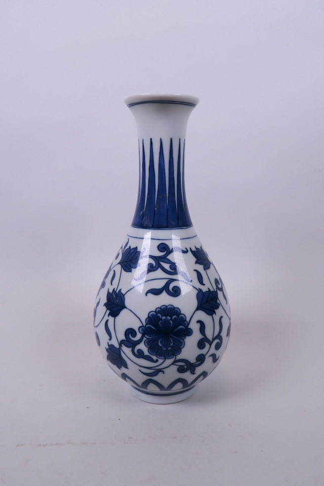 A Chinese blue and white porcelain bottle vase with entwined floral decoration, 8 character mark