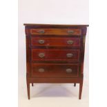 A C19th inlaid mahogany four drawer chest, with canted corners, raised on square tapering