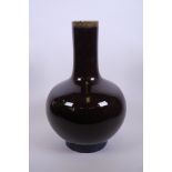 A Chinese burgundy flambé glazed pottery vase, 4 character mark to base, 13½" high