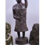 An African carved stone head of a bearded man, 6½" high, together with a carved wood figure of a