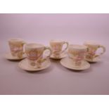 A Disney 'The Snow White Teacup Set' comprising five cups and saucers, with raised decoration of the