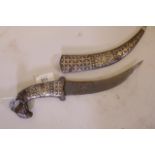 A Middle Eastern dagger with white metal decoration and ram's head handle, 14" long