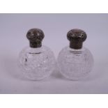 Two C19th cut glass silver topped perfume decanters, 4½" high