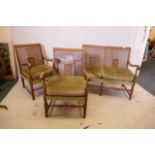 A 1930s walnut three piece bergère suite, comprising a two seater settee and two chairs, losses to