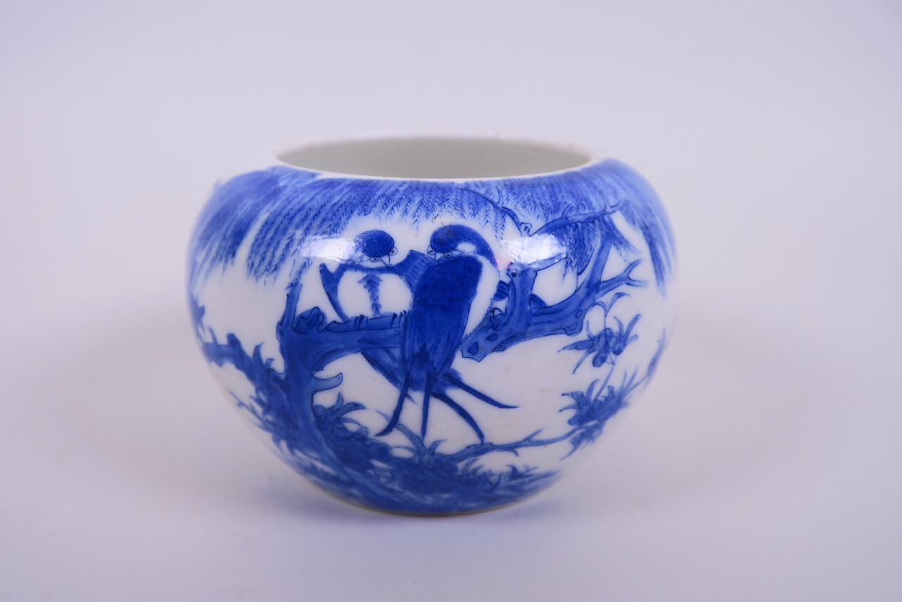 A Chinese blue and white porcelain pot decorated with birds perched on a branch 5" diameter