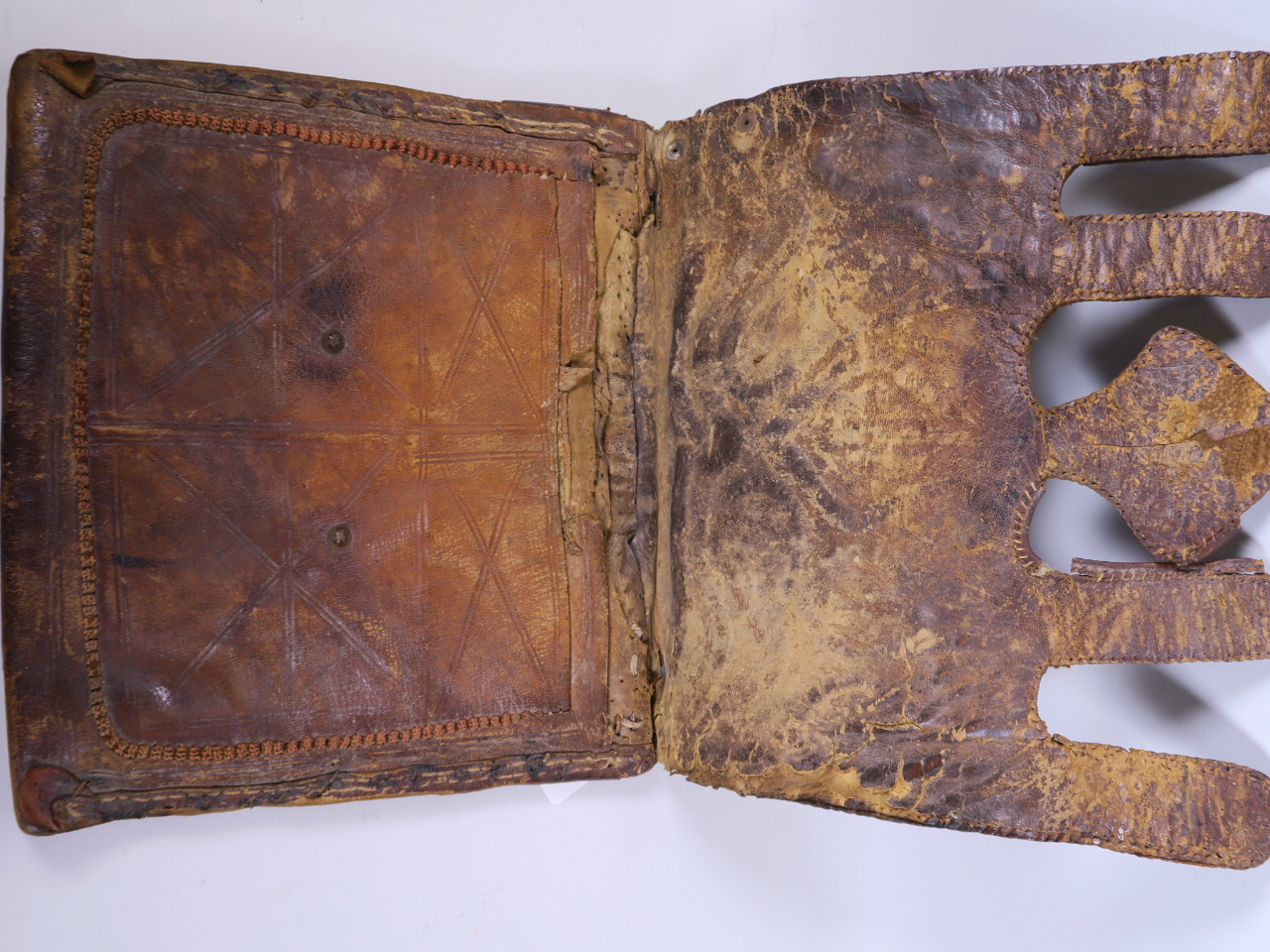 An antique leather Koran case, the front having stitched decoration of Islamic motifs, 11½" x 10" - Image 3 of 3