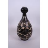 A Chinese Cizhou kiln garlic head shaped pottery vase with chased foliate decoration, 10" high