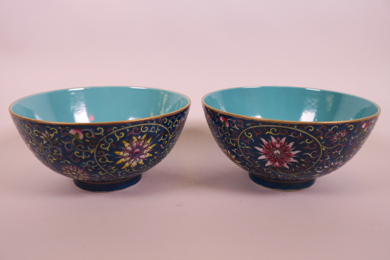 A pair of Chinese polychrome porcelain rice bowls with scrolling lotus flower decoration, 6