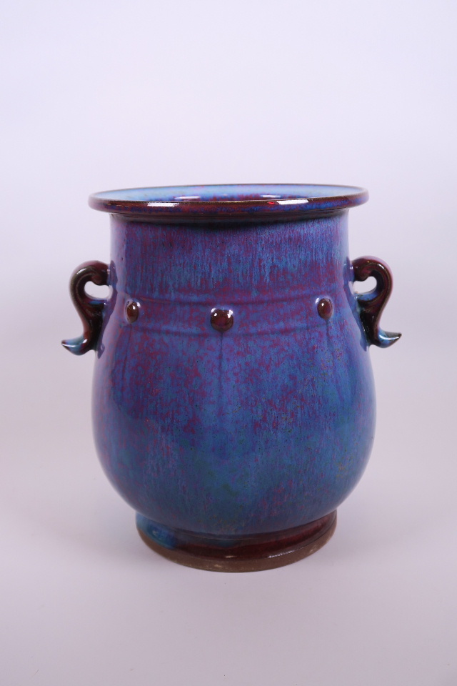 A Chinese Jun kiln pottery vase with twin handles, 9" high