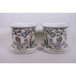 A pair of Chinese famille rose porcelain planters and saucers with enamel decoration of women in a