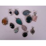 Twelve agate pendants set in white metal mounts, marked 925