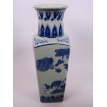 A Chinese blue and white porcelain square section vase painted with deer in a landscape, 12" high