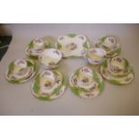 A Paragon China six place setting porcelain tea service decorated in a traditional flowers and