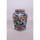 A Chinese wucai pottery vase decorated with kylin and lotus flowers, 7" high