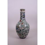 A Chinese famille verte porcelain bottle vase decorated with dragons amongst flowers, seal mark to