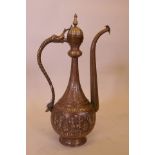 A good Middle Eastern bronze ewer, with fine inlaid copper and silver decoration and Islamic