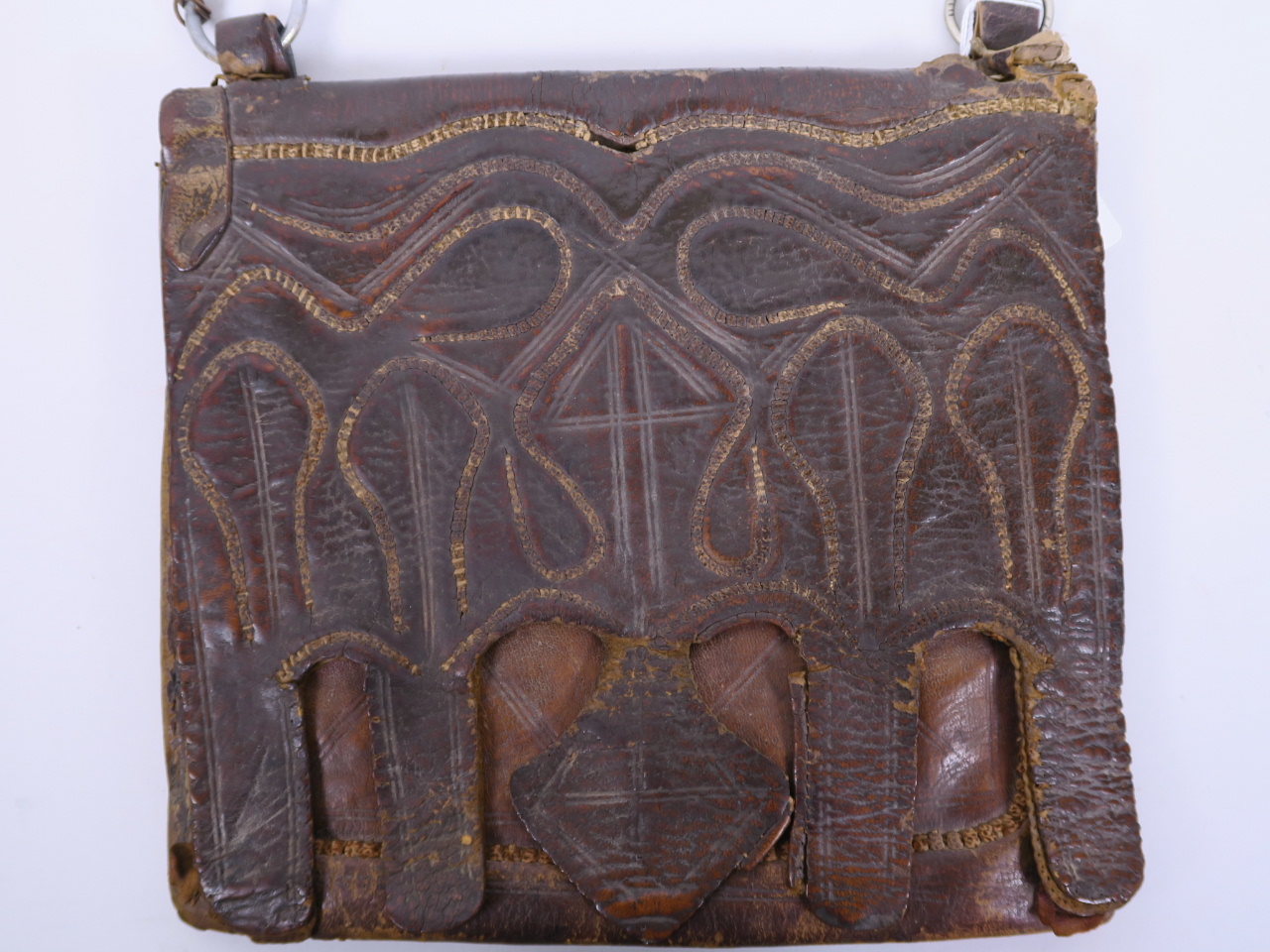 An antique leather Koran case, the front having stitched decoration of Islamic motifs, 11½" x 10" - Image 2 of 3