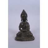 A Chinese bronze of Buddha with gilt patina, 4½" high